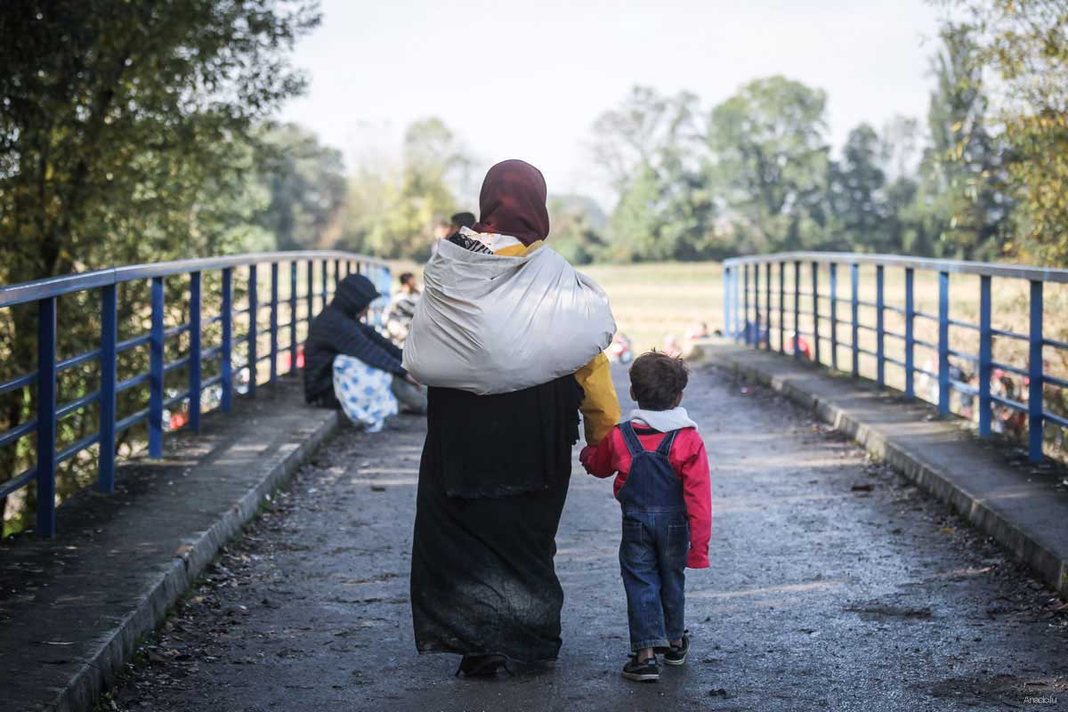 Refugees are now traveling to Austria and Germany via Slovenia after Hungary closed its borders with Croatia. The photo shows refugees walking towards a refugee camp after crossing the green border between Slovenia and Croatia in Rigonce, Slovenia on October 20, 2015