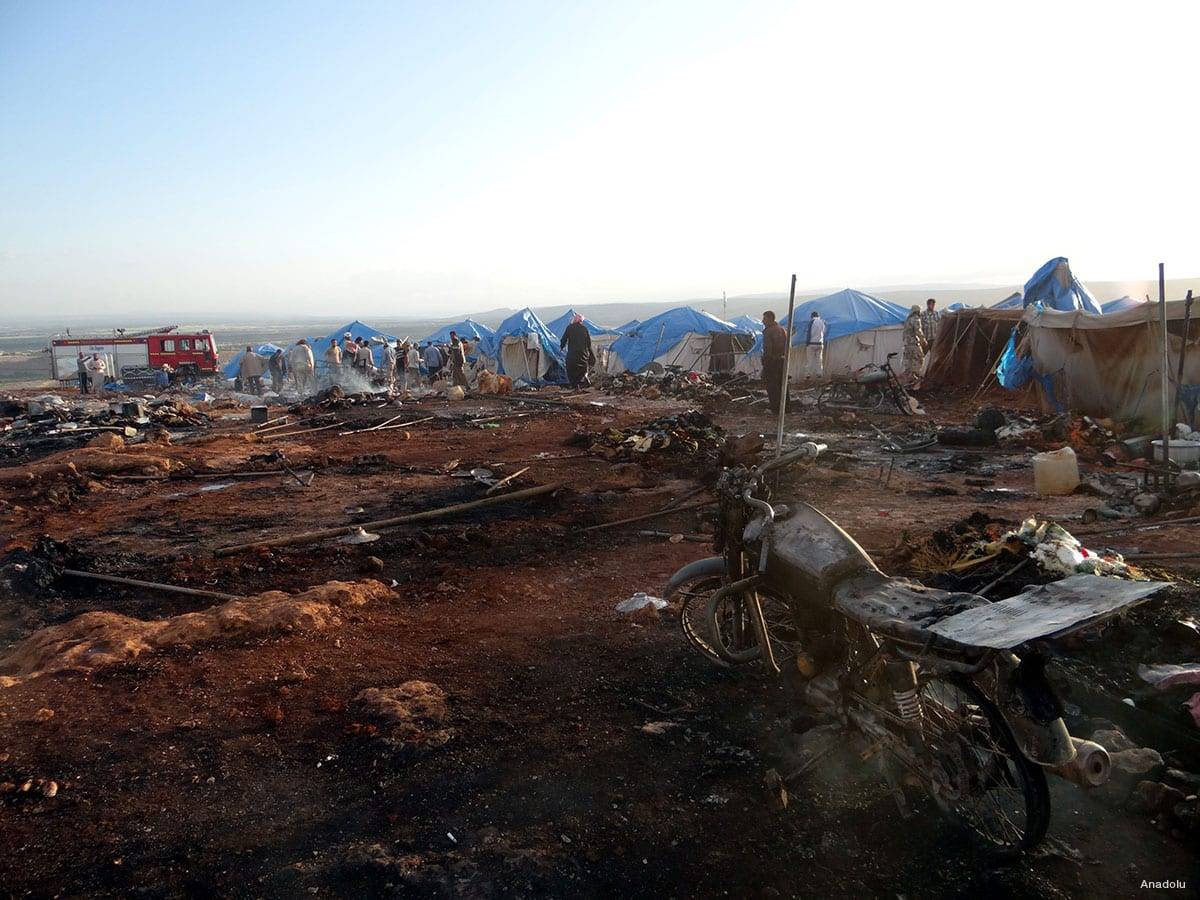 People inspect the damage after a Syrian regime warplane targeted the Kamuna refugee camp near the Syrian In the Idlib province after Syrian regime warplane targeted the camp on May 05, 2016. 8 people were killed and another 30 injured. Image by Anadolu