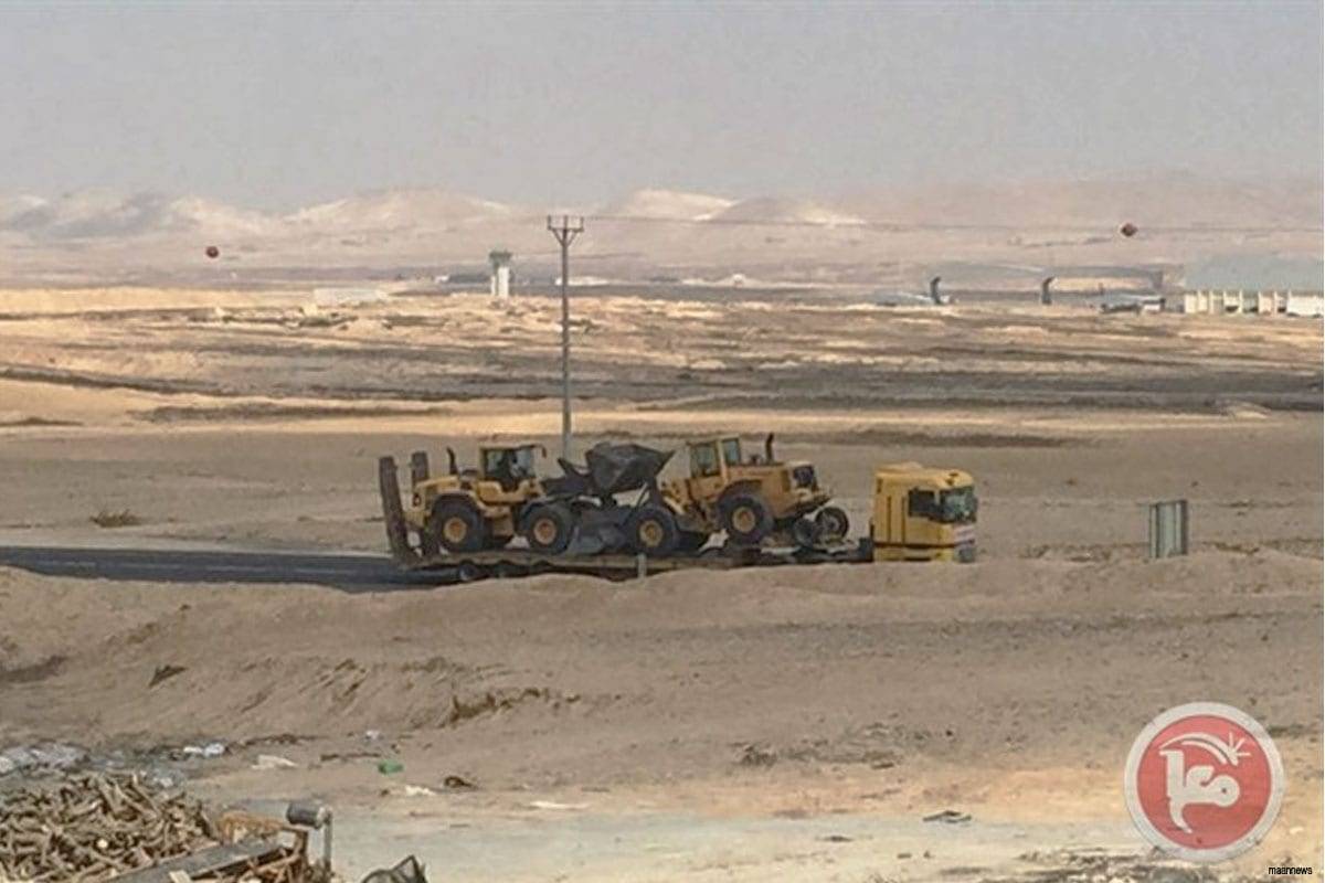 Israeli bulldozers being transported to a Palestinian village in the Negev [August 2016]