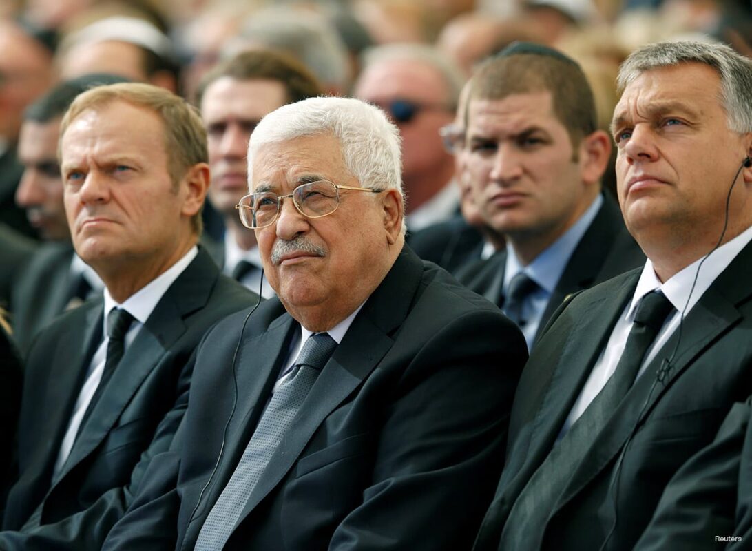 Palestinian President Mahmoud Abbas (C) sits alongside European Council President Donald Tusk (L) as they attend the funeral of Shimon Peres, 93, on Mount Herzl Cemetery in Jerusalem, September 30, 2016. [REUTERS/Abir Sultan/Pool]