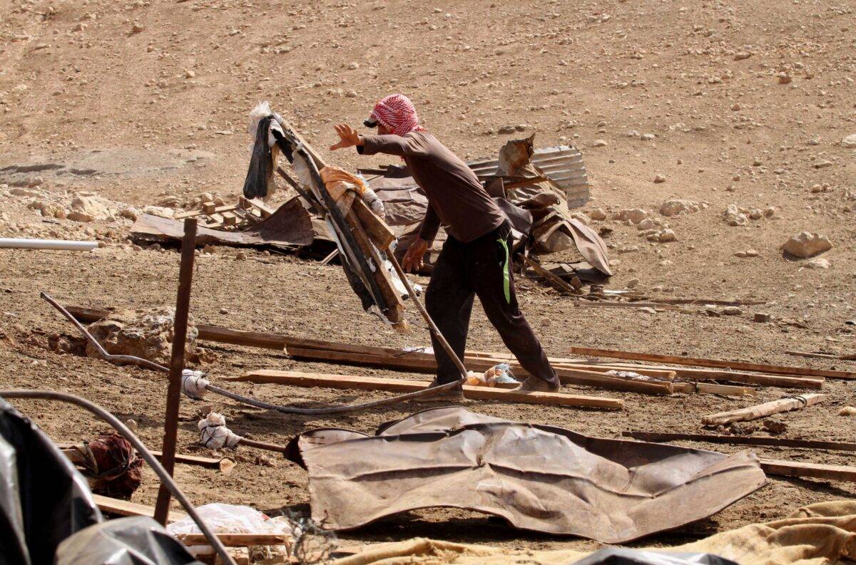Palestinians inspect the rubble of their homes after it was demolished by Israeli forces in West Bank on October 9th 2016 [Nedal Eshtayah/Anadolu Agency]