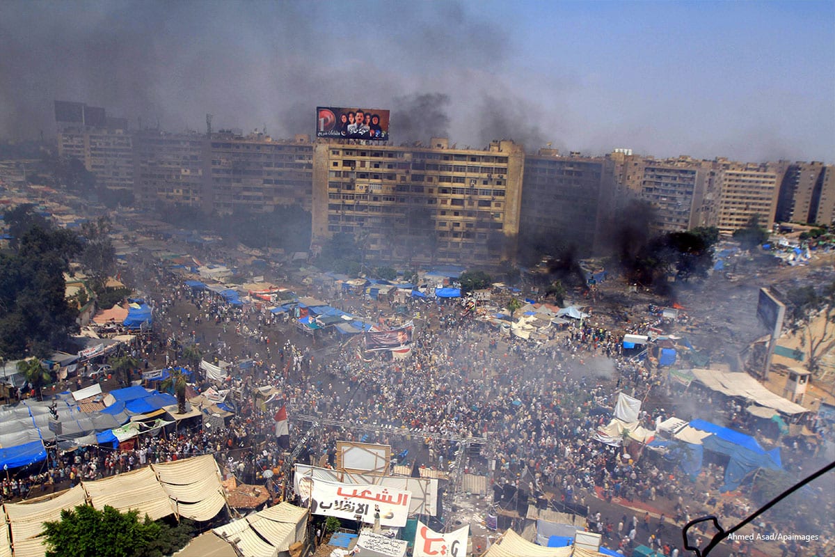 Smoke rises at Rabaa al-Adawya square in Cairo on 14 August 2013 [Ahmed Asad/Apaimages]