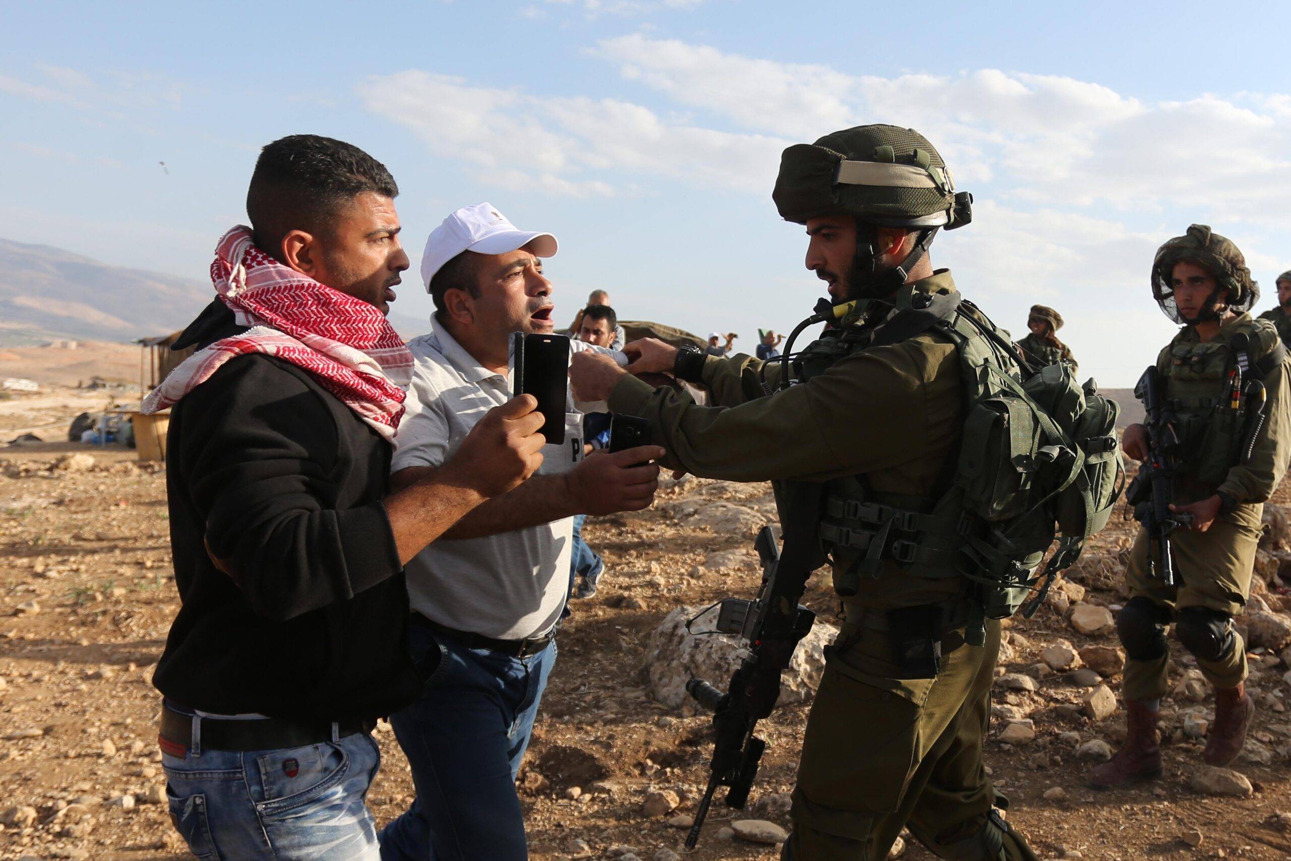 JERICHO, WEST BANK: Israeli security forces intervene Palestinian protesters with real and plastic bullets and tear gas during a demonstration at the symbolic region named 'Yasser Arafat Village' in Al-Agvar region of Jericho, West Bank on November 17, 2016. ( Issam Rimawi - Anadolu Agency )