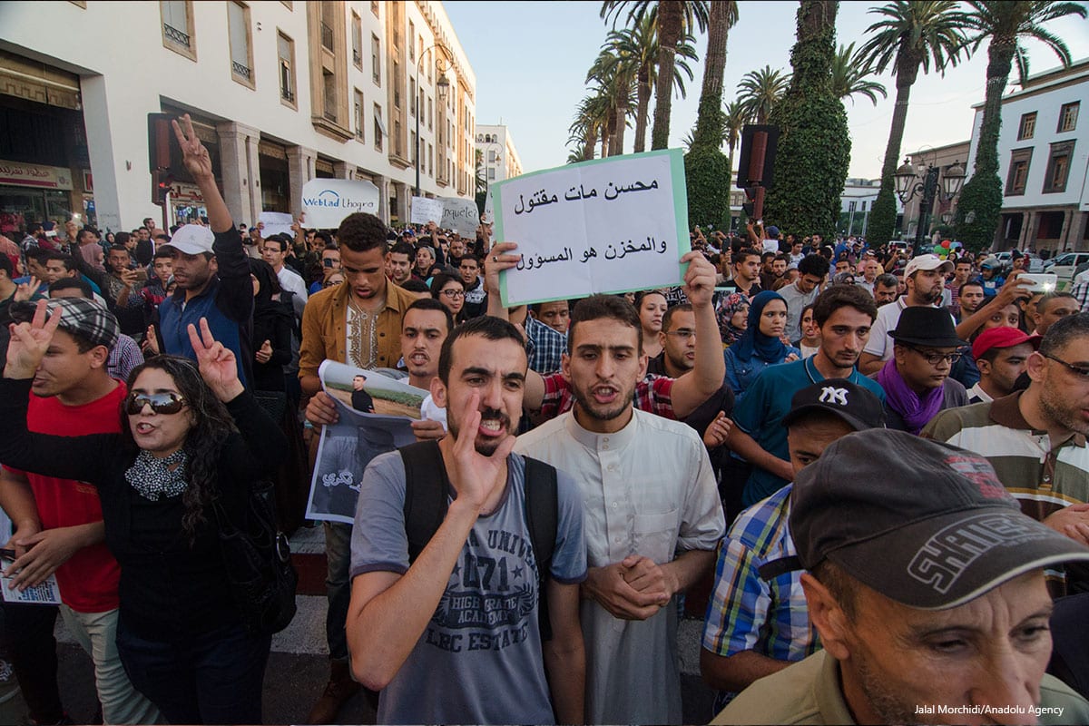 Moroccan people stage a protest after a fisherman, Mohcine Fikri, was crushed to death in a garbage truck, in Morocco on October 30 2016 [Jalal Morchidi/Anadolu Agency]