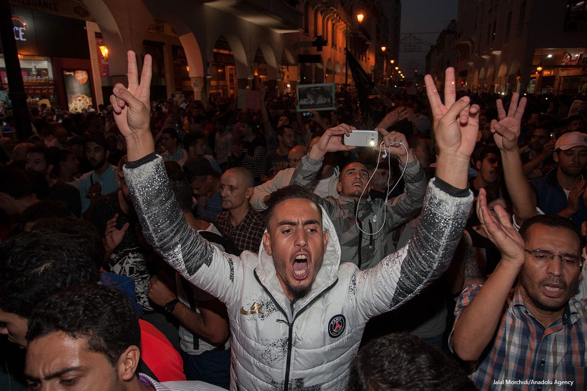 Moroccan people stage a protest after a fisherman Mohcine Fikri, crushed to death in a garbage truck, in front of Internal Ministry in Rabat, Morocco on October 30 2016 [Jalal Morchidi/Anadolu Agency]