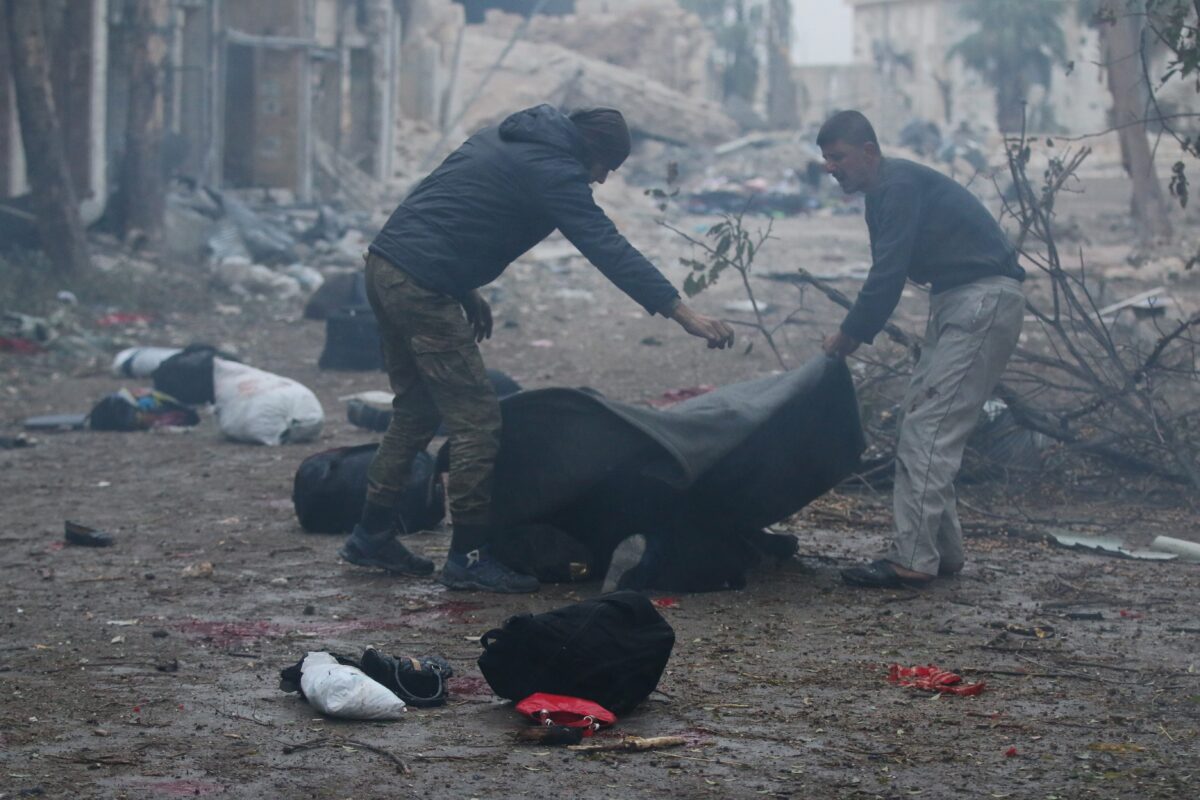 ALEPPO, SYRIA - NOVEMBER 30: [EDITOR'S NOTE: Image depicts death] Syrians try to carry a dead body after war crafts belonging to the Assad Regime forces carried out airstrikes over redidential areas at the Jub Al Quba neighborhood in Aleppo, Syria on November 30, 2016. 45 Civilians including children and women have been killed during the airstrikes.  ( Jawad al Rifai - Anadolu Agency )