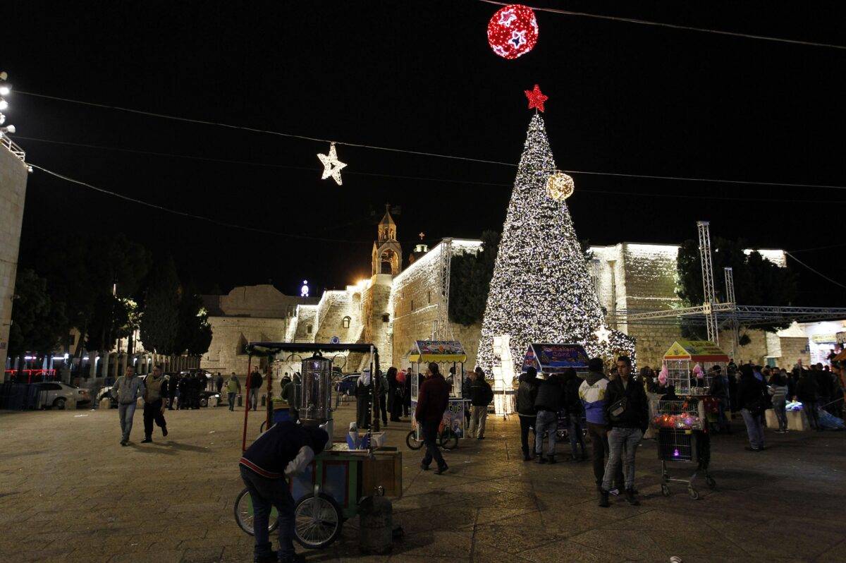 Streets and avenues near the Church of the Nativity are illuminated with Christmas lights in Bethlehem, West Bank on 11 December 2016 [Wisam Hashlamoun / Anadolu Agency]