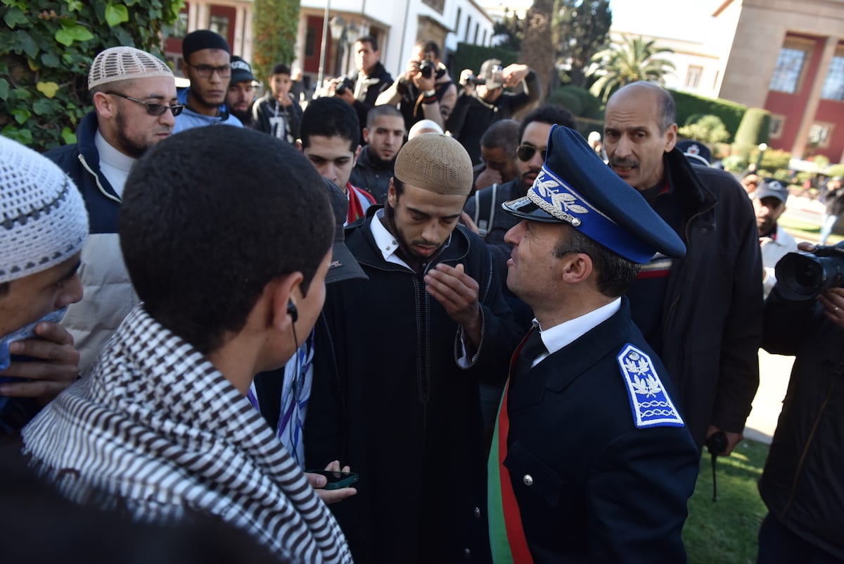 Image of Moroccan security forces dispersing the crowd during a protest [Jalal Morchidi/Anadolu Agency]