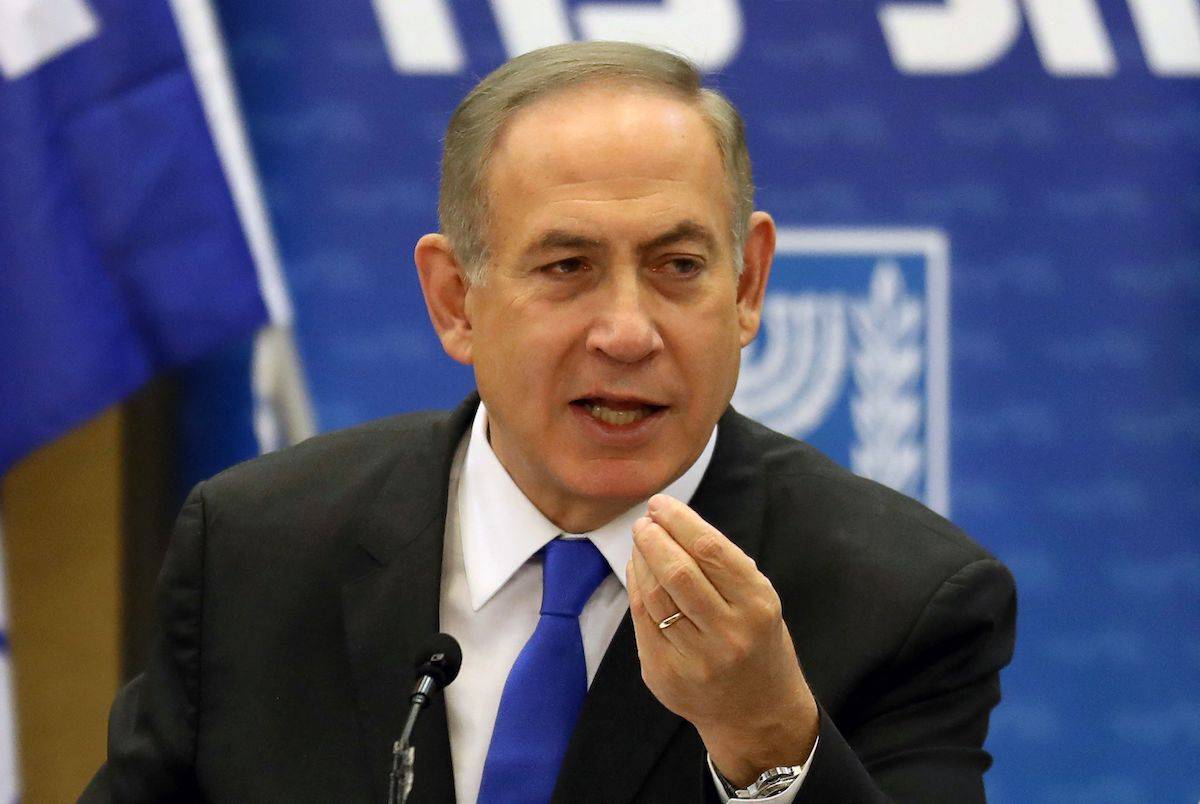 Israeli Prime Minister Benjamin Netanyahu gestures as he speaks during a Likud faction meeting at the Knesset (Israel's Parliament) in Jerusalem on January 2, 2017. Netanyahu denied any wrongdoing ahead of his expected questioning by police in a graft probe, telling his political opponents to put any "celebrations" on hold. [GALI TIBBON/AFP via Getty Images]