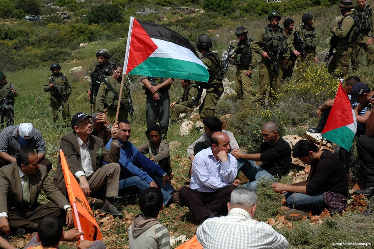 Palestinian protesters pray during a demonstration against Jewish settlements in the Palestinian village of Deir Estia in the occupied West Bank on 2 April 2010 [Najeh Hashlamoun/Apaimages]