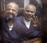 Vice chairman of the Freedom And Justice Party Mohamed Beltagy (L) and Senior political figures of the Muslim Brotherhood Saad El-Katatni (R) are seen during a trial session over the Wadi el-Natrun prison case at Cairo Police Academy in Egypt on 26 February, 2017 [Moustafa El Shemy/Anadolu Agency]