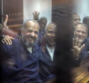 Vice chairman of the Freedom And Justice Party Mohamed Beltagy (L), Senior political figures of the Muslim Brotherhood Saad El-Katatni (C) and Vice chairman of the Freedom And Justice Party Essam el-Erian (R) gesture during a trial session over the Wadi el-Natrun prison case at Cairo Police Academy in Egypt on February 26, 2017 [Moustafa El Shemy/Anadolu Agency]