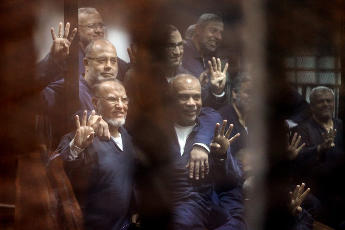 Senior political figures of the Muslim Brotherhood Saad El-Katatni (2nd L) gesture during a trial session over the Wadi el-Natrun prison case at Cairo Police Academy in Egypt on 26 February, 2017 [Moustafa El Shemy/Anadolu Agency]