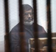 Egypt’s ousted President Mohamed Morsi attends a trial session over the Wadi el-Natrun prison case at Cairo Police Academy in Egypt on 26 February, 2017. ( Moustafa El Shemy - Anadolu Agency )