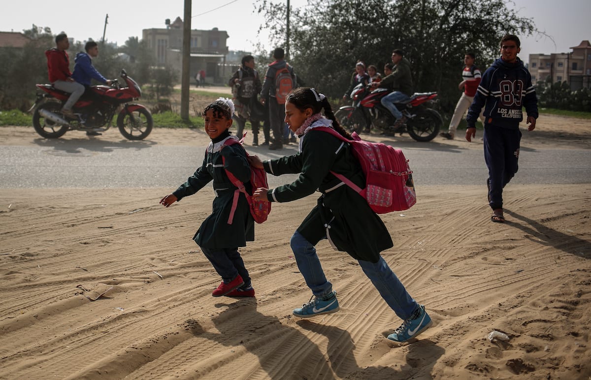 Palestinian students are seen after Israel carried out airstrikes near the primary school in Rafah, Gaza on 27 February 2017 [Ali Jadallah - Anadolu Agency]