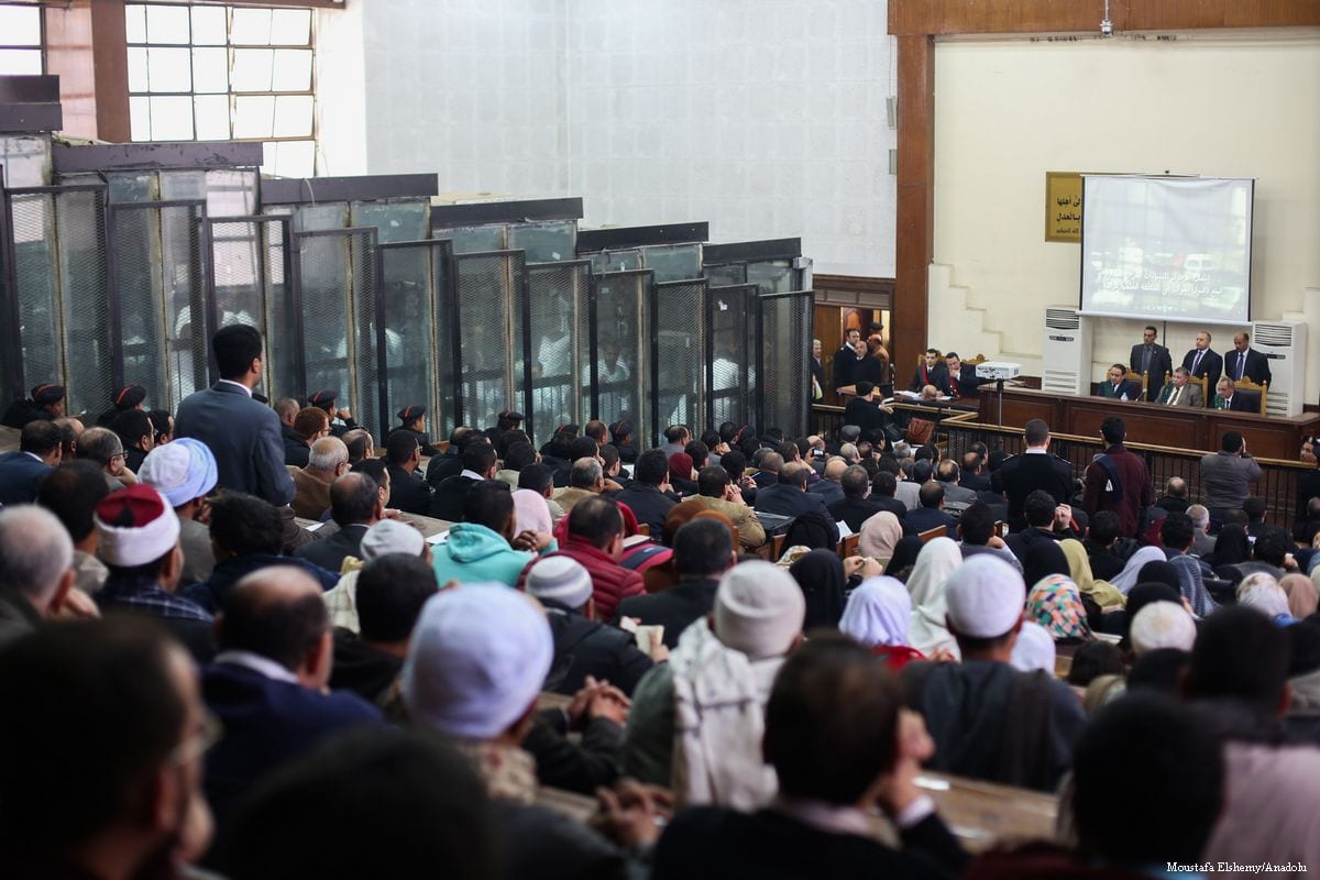 File photo from a trial against members of the Muslim Brotherhood taking place in Cairo, Egypt on 7 February 2017. The accused brotherhood members are seen inside the cage. [Moustafa Elshemy - Anadolu Agency]