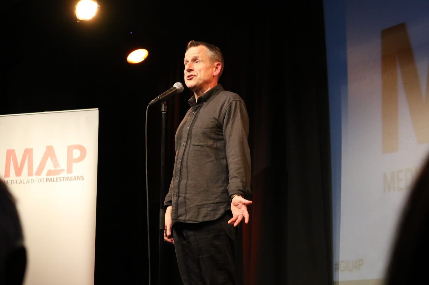 Jeremy Hardy on stage during the Give It Up to Palestine event in London on 20 February, 2017 [Jehan Alfara/Middle East Monitor]