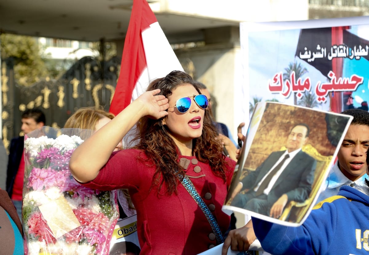 People gather in front of the Al Maadi Hospital to celebrate the prosecutors order to release ex-president Hosni Mubarak in Cairo, Egypt on March 19, 2017 [Fared Kotb - Anadolu]