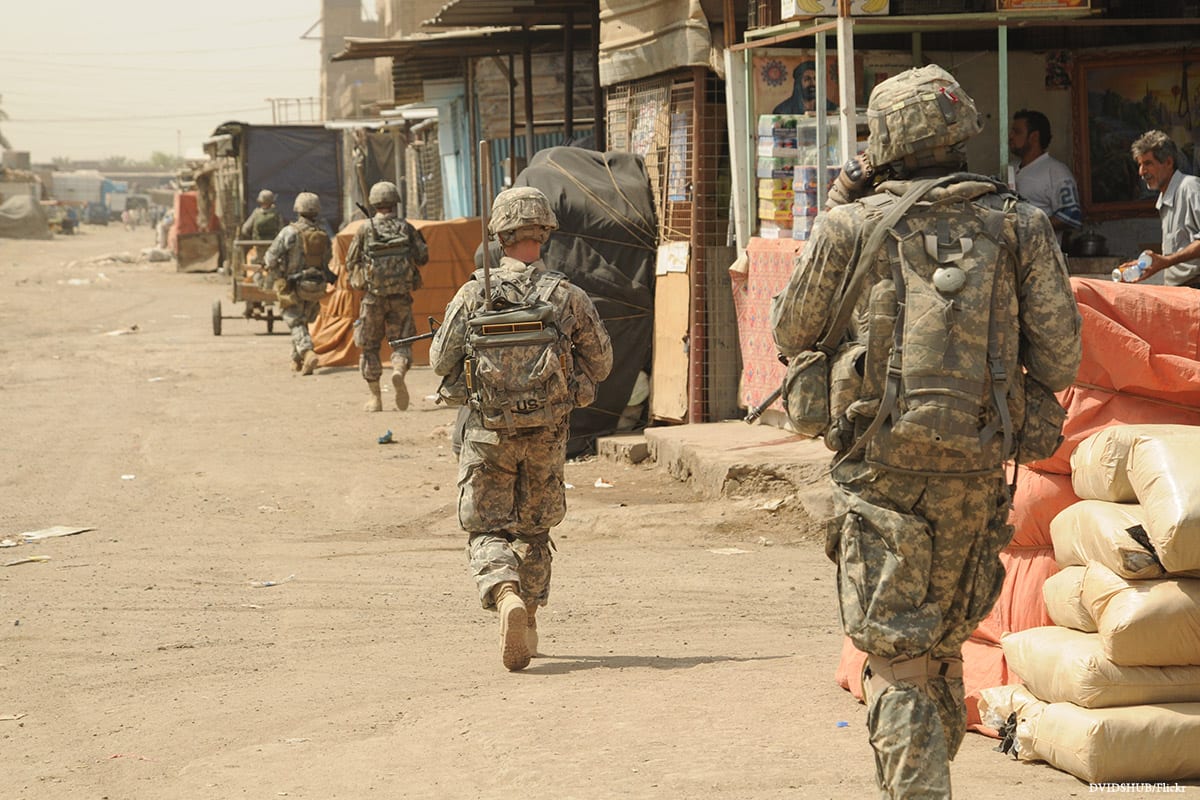 Image of US soldiers during the 2003 invasion in Baghdad, Iraq [DVIDSHUB/Flickr]