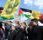 People hold banners and flags as they gather at Schuman Square to protest against Israel in Brussels, Belgium on April 19, 2017 [Dursun Aydemir /Anadolu Agency]