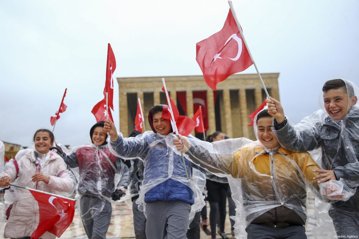 Children wave Turkish flags as Turkish people with their children visit Ataturk's mausoleum, Anitkabir, during the National Sovereignty and Children's Day in Ankara, Turkey on April 23, 2017 [Emrah Yorulmaz / Anadolu Agency]
