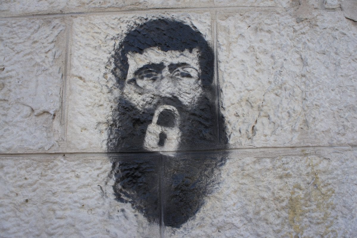 Khader Adnan stencil on a wall by Manara square, Ramallah on February 23, 2012 [Wikipedia]