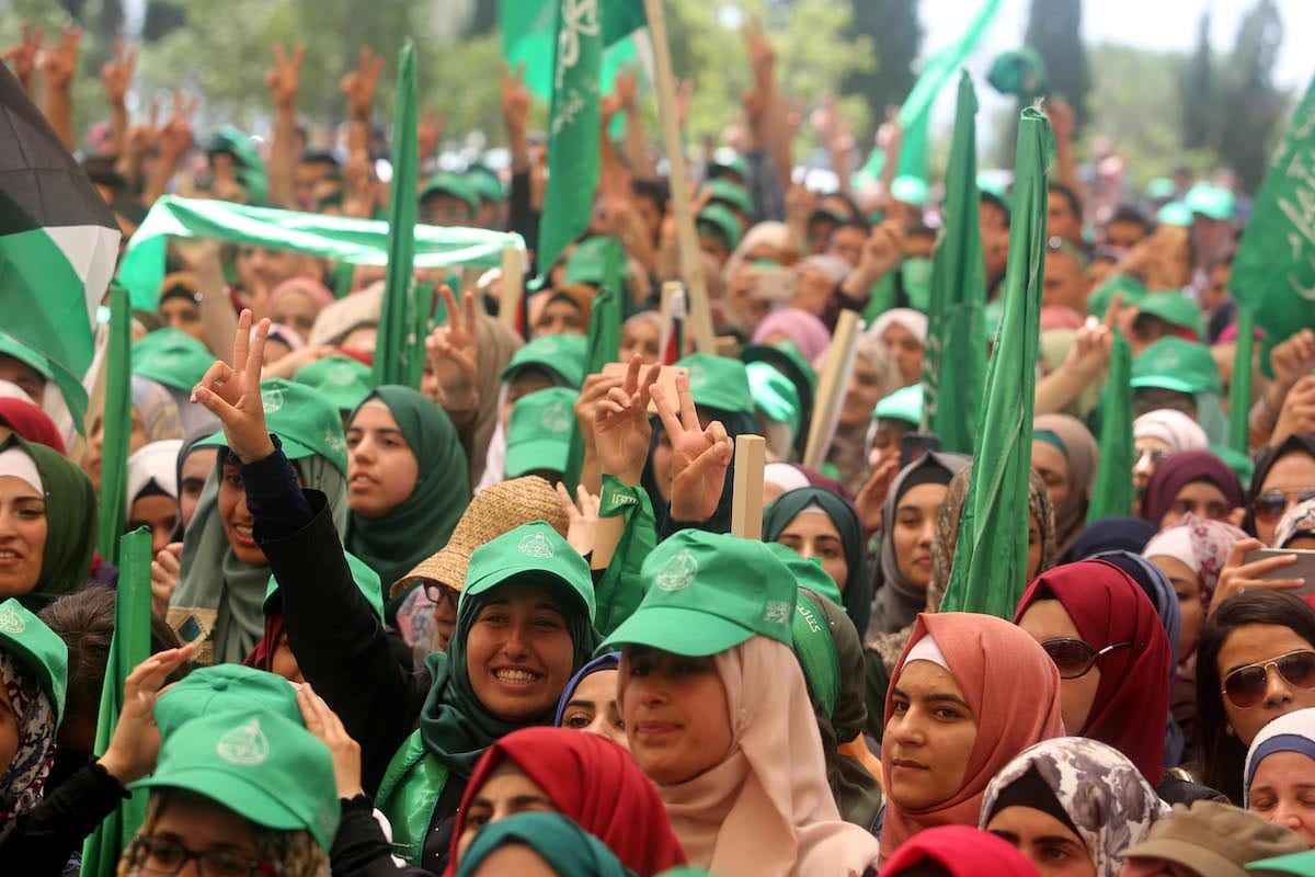 Students who support Hamas gather to attend the debate held ahead of the student council elections, at Bir Zeit University in Ramallah, West Bank [Issam Rimawi/Anadolu Agency]