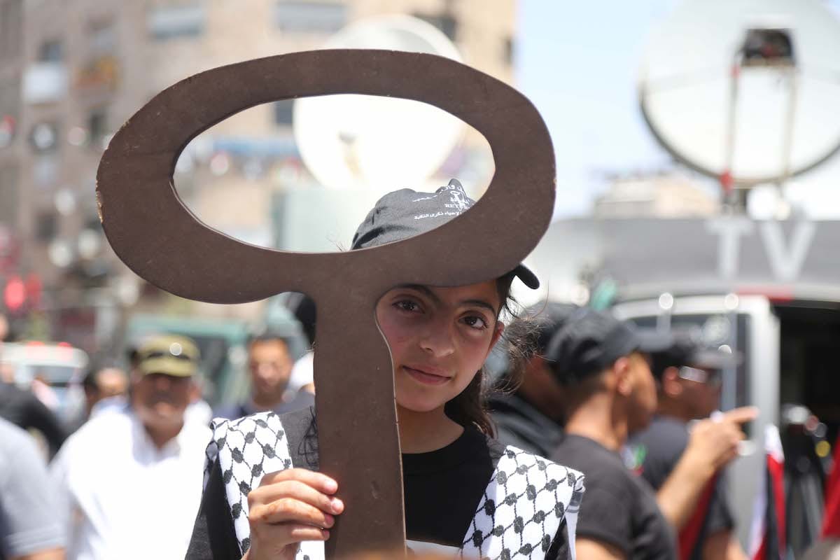 Palestinians march during a demonstration marking the 69th anniversary of Nakba, also known as Day of the Catastrophe in 1948, Ramallah, West Bank on May 15, 2017 [Issam Rimawi/Anadolu Agency]