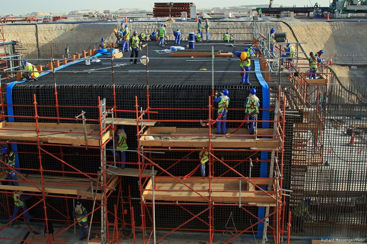 Image of workers gathering at a construction site in Qatar [Richard Messenger/Flickr]