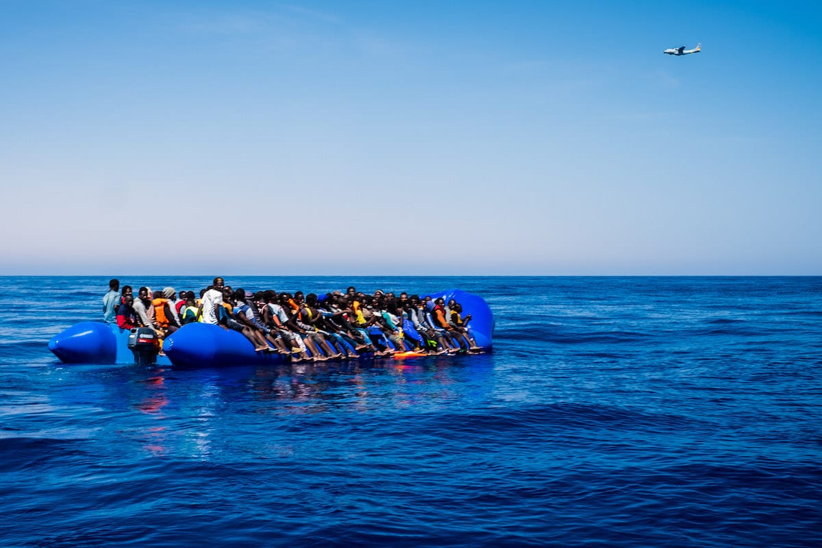 Refugees are seen after being rescued from the Mediterranean Sea on 15 June 2017 [Marcus Drinkwater/Anadolu Agency]