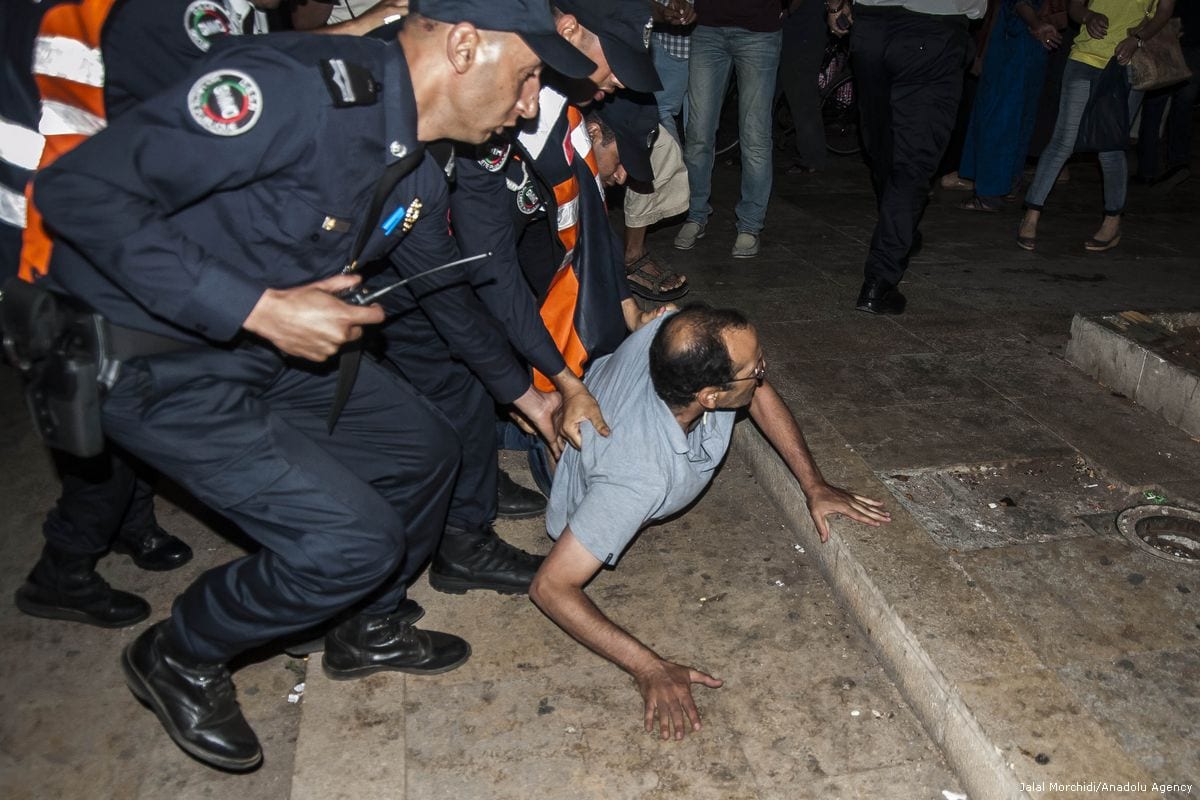 Moroccan security forces arrest protesters during a demonstration in support of the Rif Movement in Rabat, Morocco on 20 June 2017 [Jalal Morchidi/Anadolu Agency]