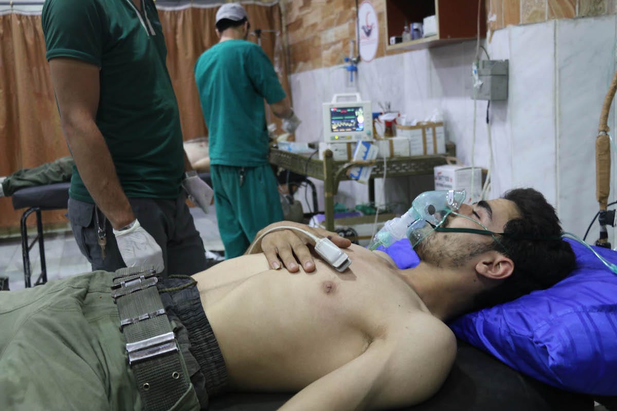 Opposition forces receive medical treatment after the Assad regime allegedly carried out a chemical gas attack in the de-conflict zone in Damascus, Syria on 20 July 2017 [Alaa Muhammed/Anadolu Agency)