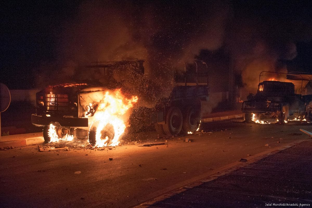 Vehicles on fire during a protest demanding the release of detainees in Al Hoceima, Morocco on 21 July 2017 [Jalal Morchidi/Anadolu Agency]