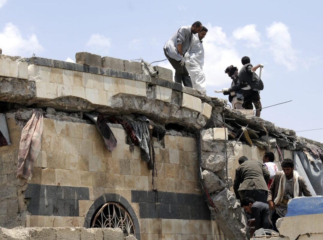 People search for survivors after airstrikes carried by the Saudi-led coalition over Arhab District of Sanaa, Yemen on 23 August 2017 [Mohammed Hamoud/Anadolu Agency]