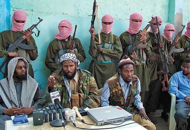 Mukhtar Robow Abu Mansur (centre) seen during a Al-Shabaab press conference during his time as the group's spokesperson
