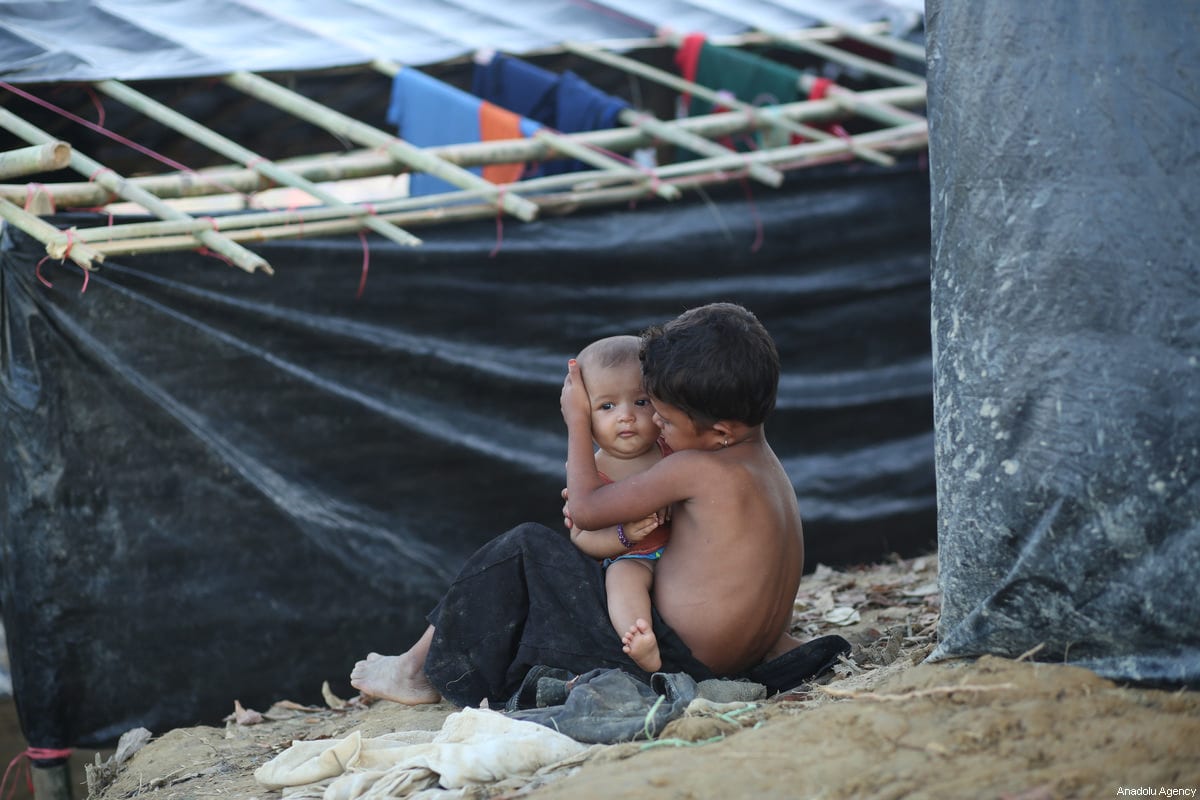 Rohingya refugee kid is seen at a makeshift refugee camp in Cox's Bazar, Bangladesh on September 25, 2017. According to UNICEF, about 2,30,000 refugee child entered in Bangladesh which is 60 percent of Rohingya refugee that have entered in last month. [zakir hossain chowdhury - Anadolu Agency]