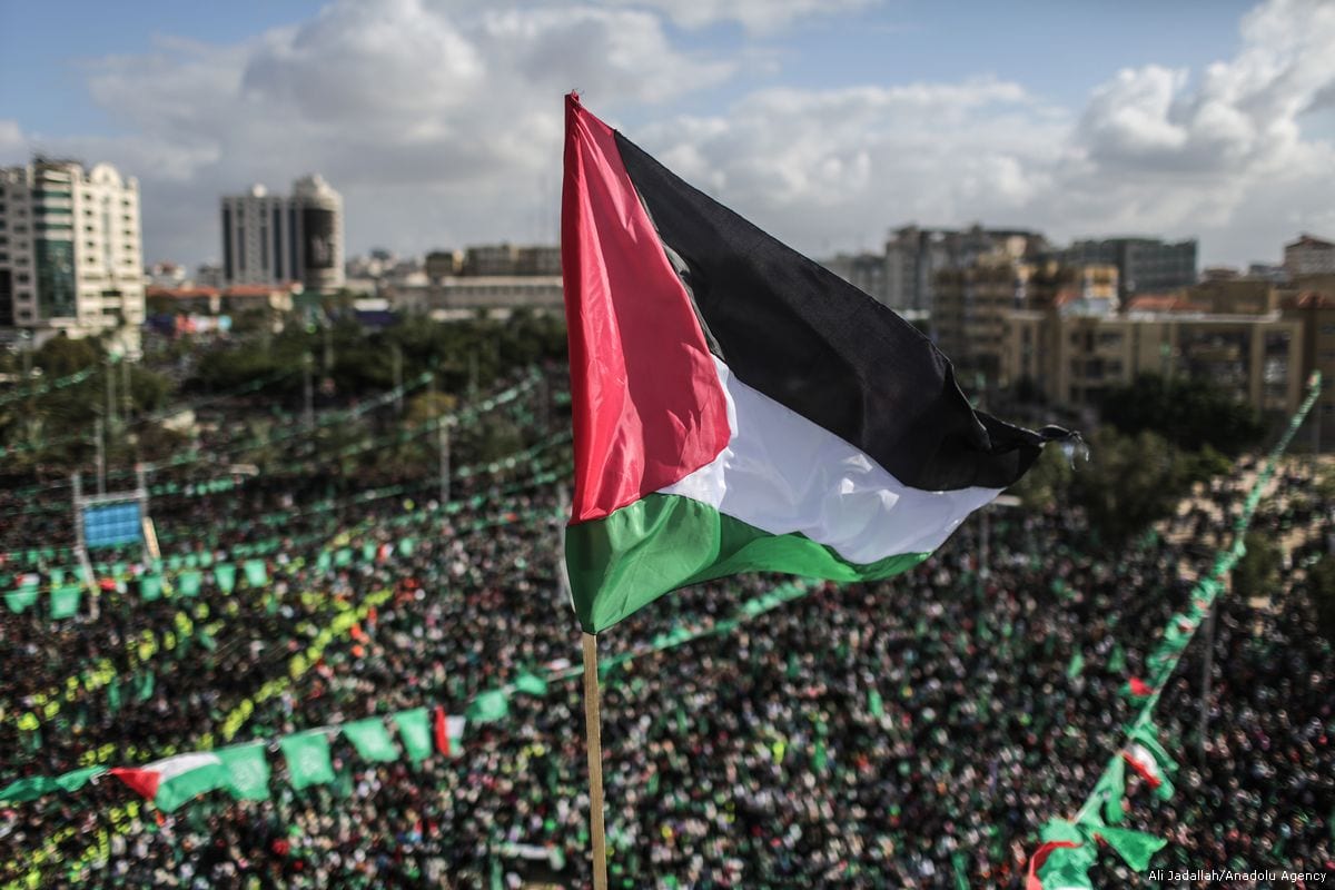 Palestinian people gather at Al-Katiba Square during an event held to mark the 30th anniversary of Hamas, on December 14, 2017 in Gaza City, Gaza [Ali Jadallah / Anadolu Agency]