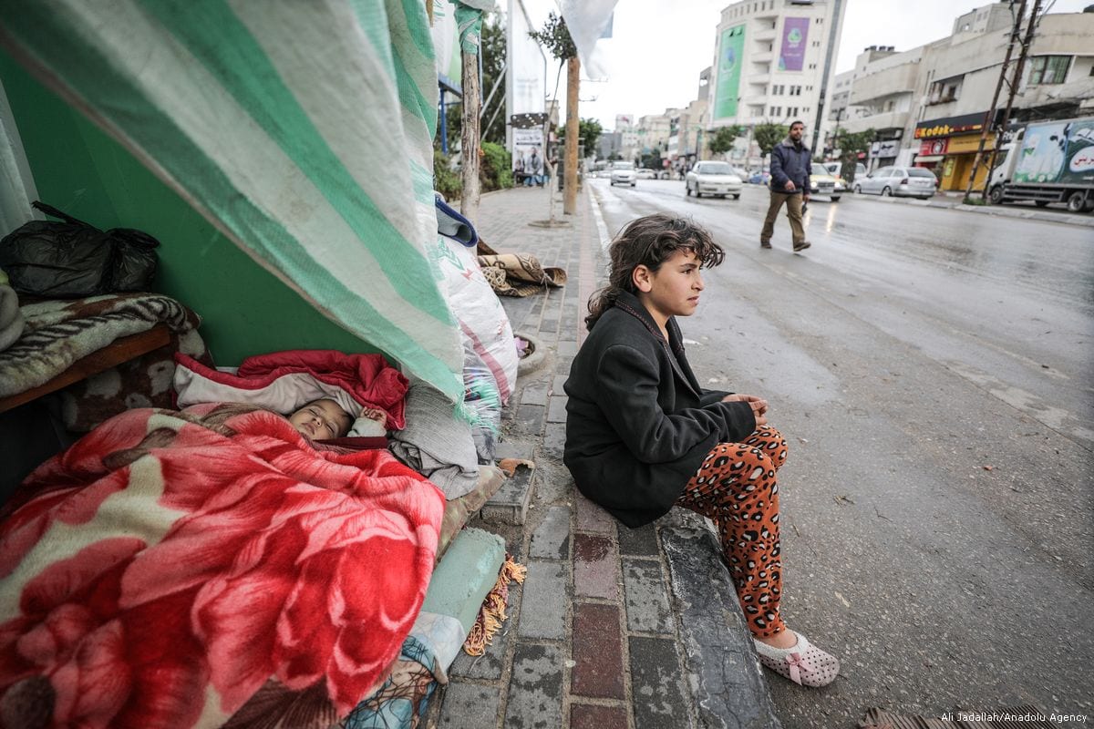 A Palestinian child is seen outside her makeshift tent in Gaza City, Gaza [Ali Jadallah/Anadolu Agency]