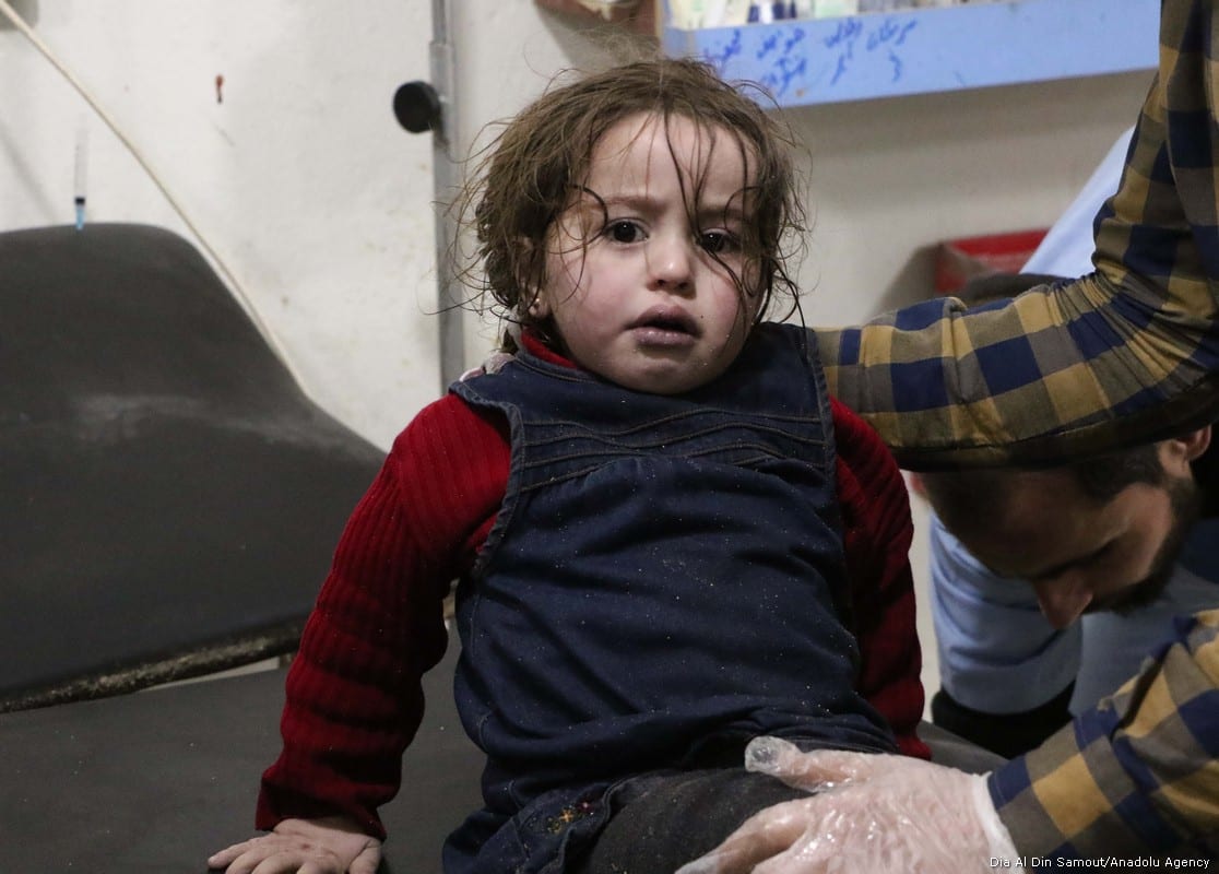 An affected child and a man receive a medical treatment after Assad regime forces conduct allegedly poisonous gas attack on Sakba and Hammuriye districts of Eastern Ghouta, in Damascus, Syria on 7 March, 2018 [Dia Al Din Samout/Anadolu Agency]