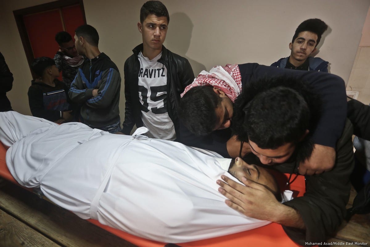 Thousands of Gazans attend funeral of Palestinian journalist Ahmed Abu Hussein