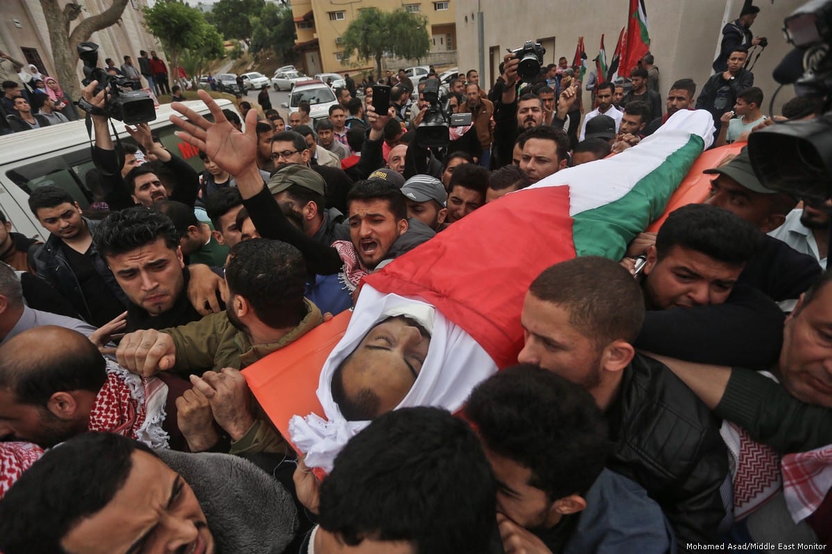 Thousands of Gazans attend funeral of Palestinian journalist Ahmed Abu Hussein