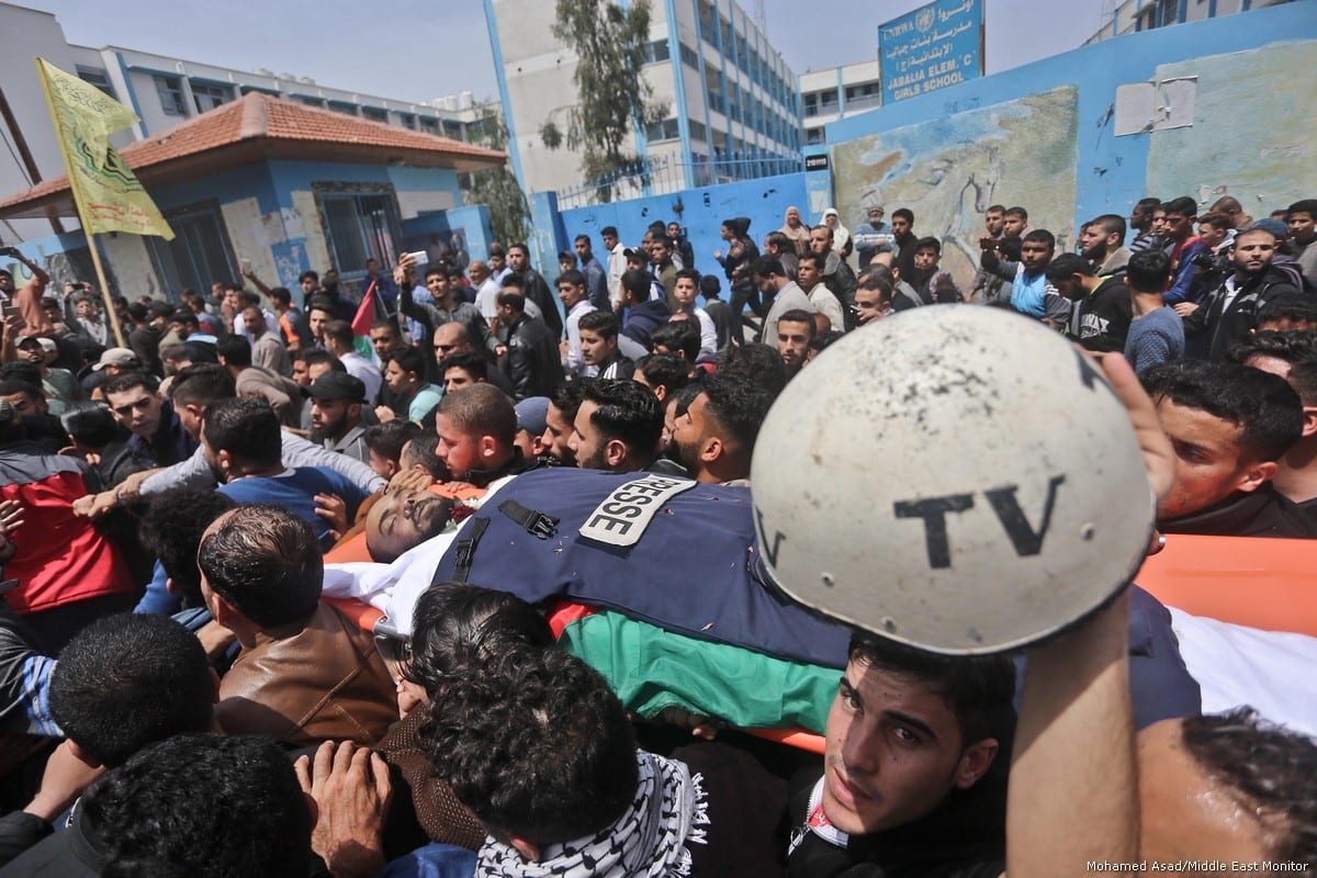 Thousands of Gazans attend funeral of Palestinian journalist Ahmed Abu Hussein [Mohamed Asad/Middle East Monitor]