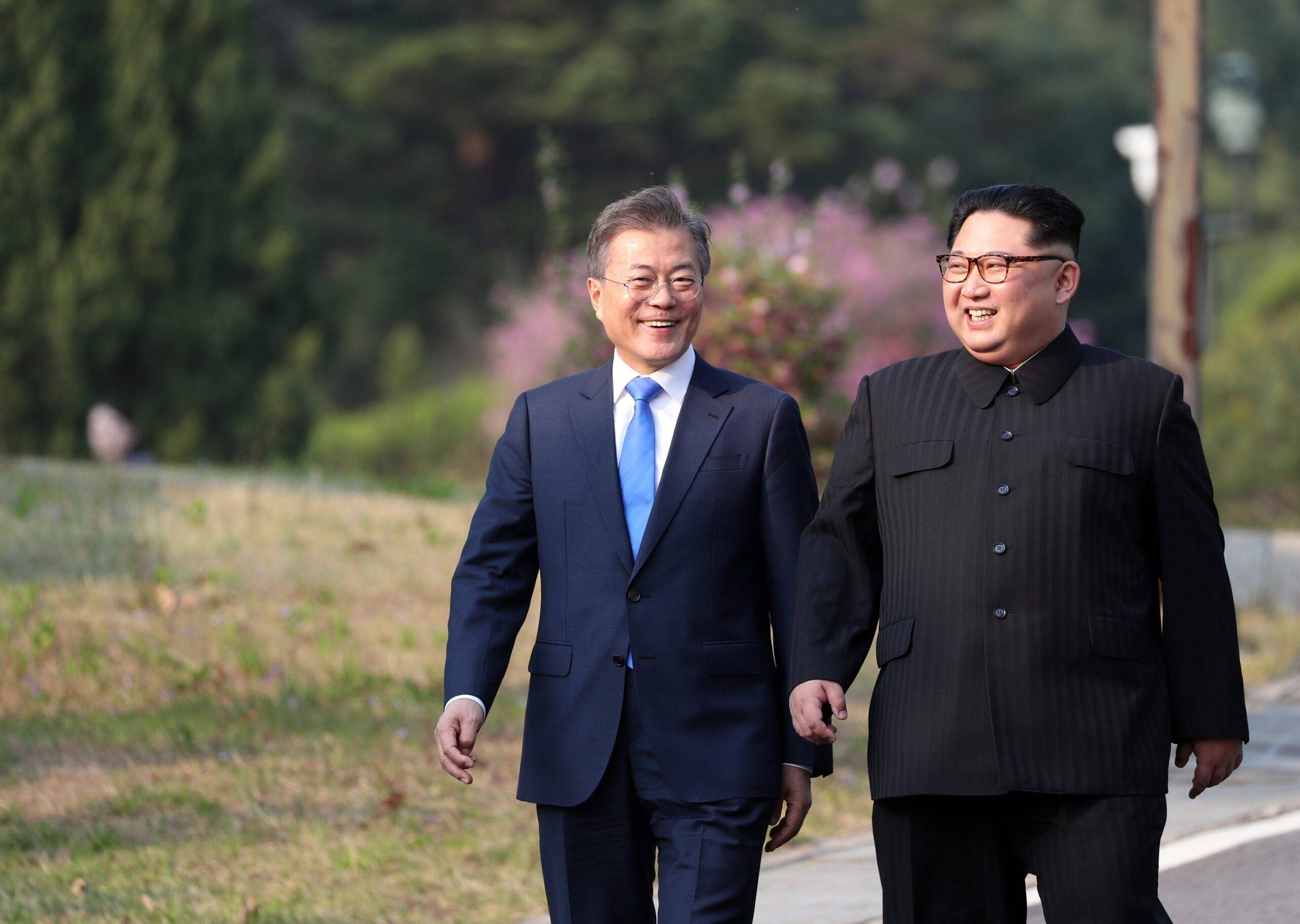South Korean president, Moon Jae-in (L) and North Korean leader Kim Jong-un (R) take a walk after planting a commemorative tree in the Peace House building at the southern side of the truce village of Panmunjom, South Korea on 27 April, 2018 [Anadolu Agency]