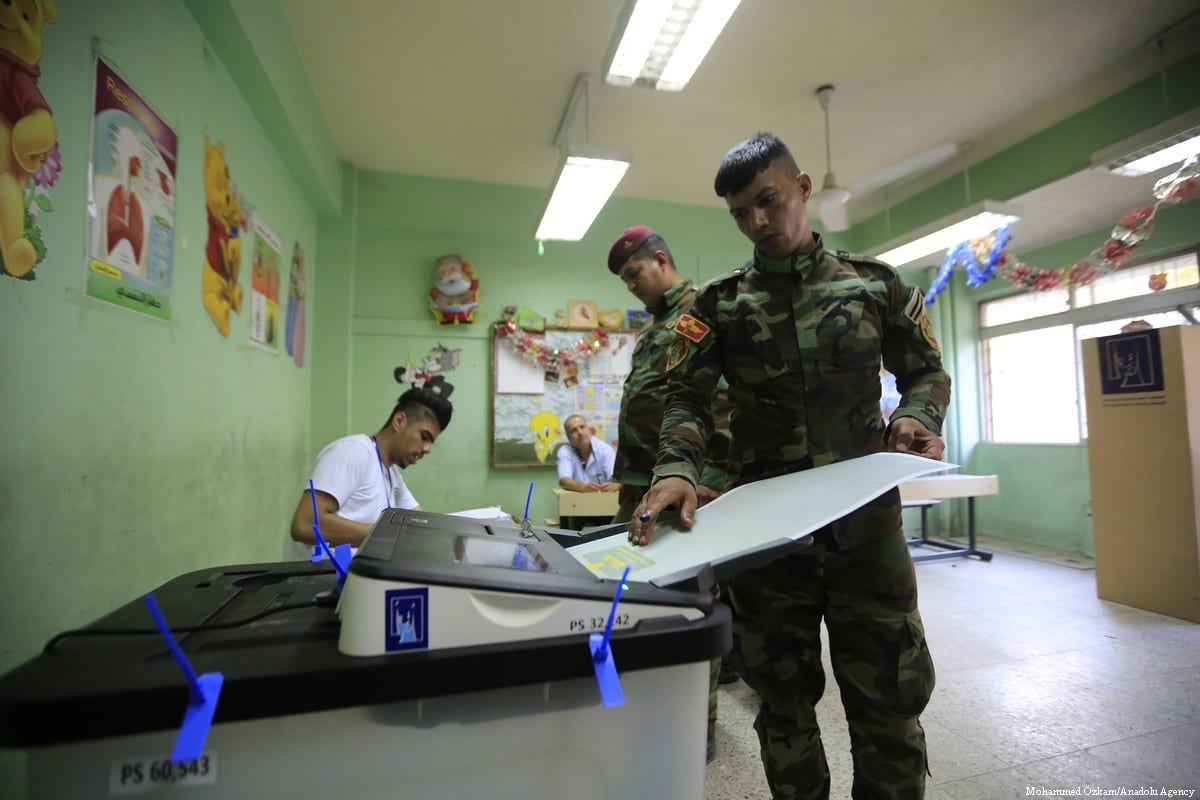 Iraqi security forces cast their vote during the Iraqi parliamentary election in Baghdad, Iraq on 10 May 2018 [Murtadha Sudani/Anadolu Agency]