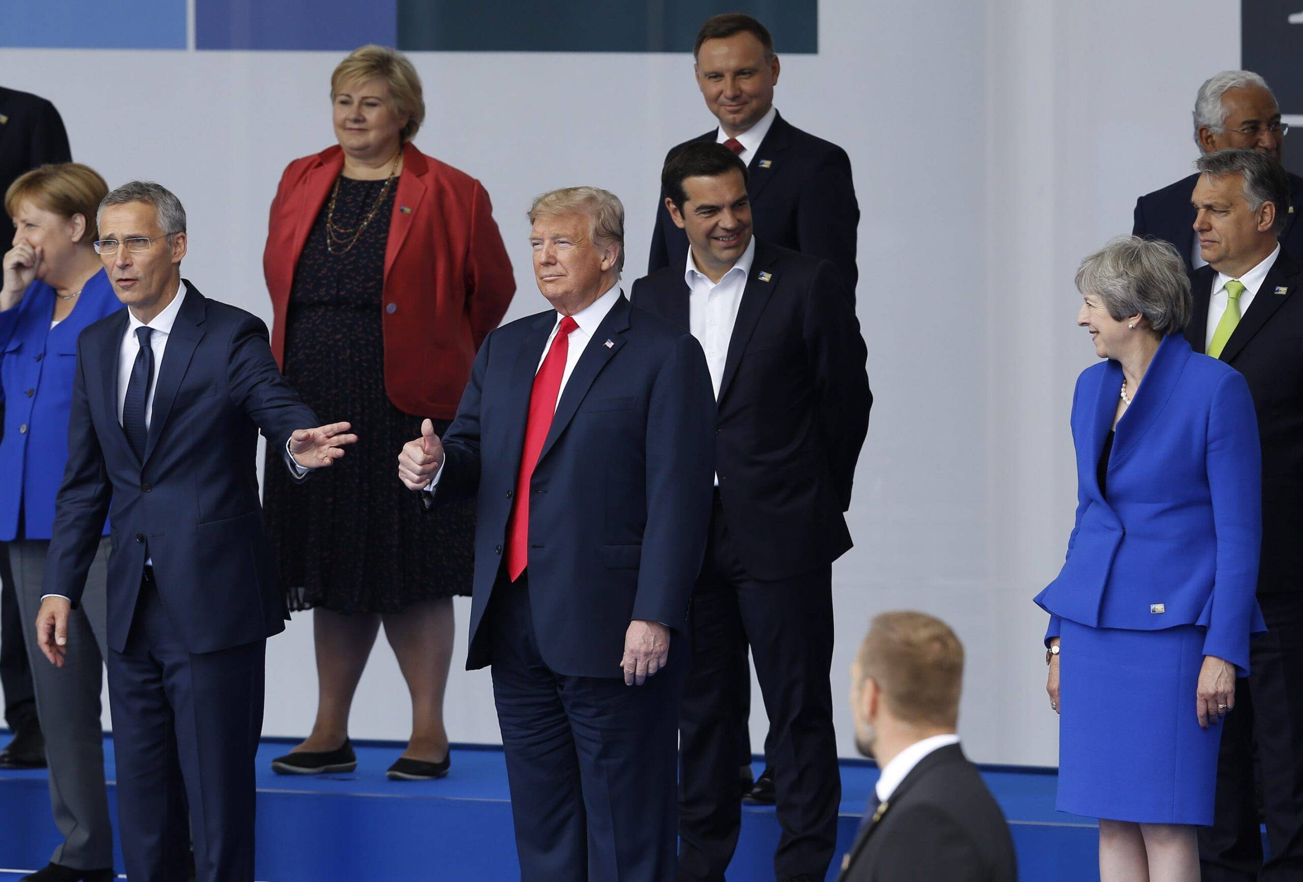 U.S. President Donald Trump (C), British Prime Minister Theresa May (R) and NATO Secretary General Jens Stoltenberg (L) attend the 2018 NATO Summit at NATO headquarters on 11 July, 2018 in Brussels, Belgium. [Murat Kaynak/Anadolu Agency]
