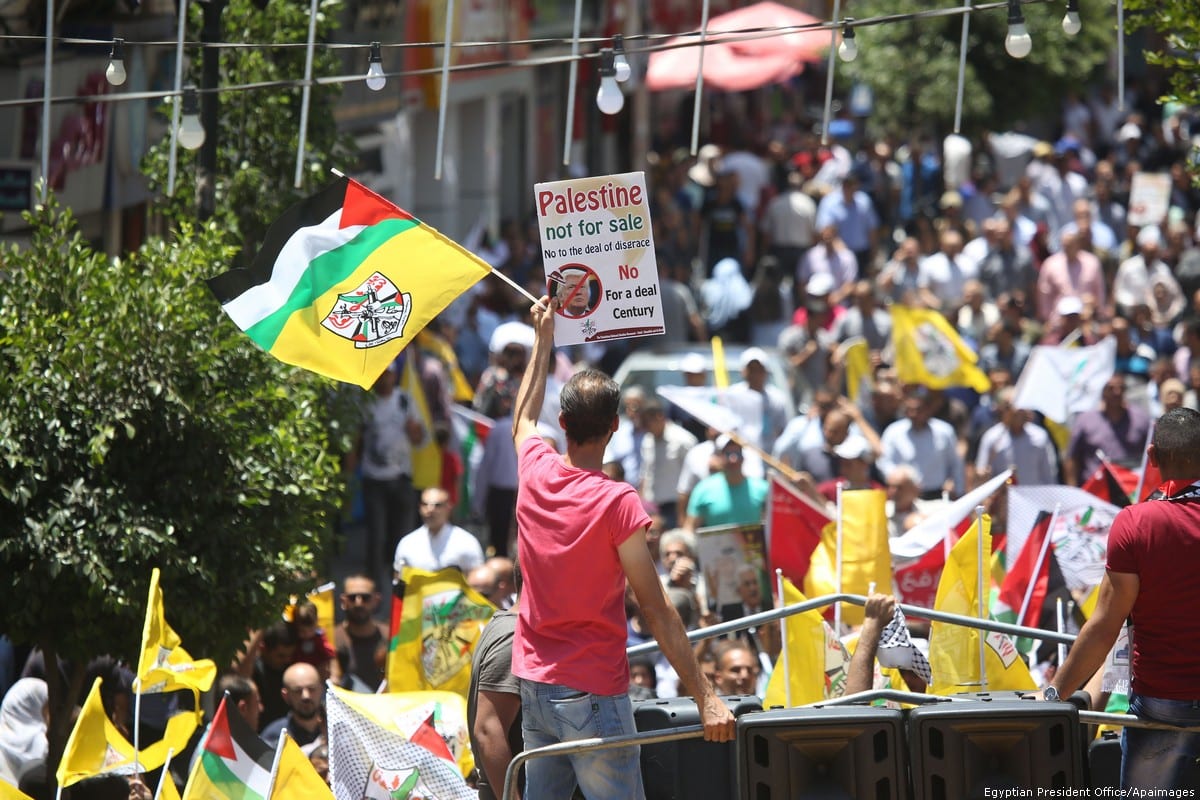 Palestinians stage a protest against the 'Deal of the Century', planned by US President Donald Trump to solve the conflict between Palestine and Israel, in Ramallah, West Bank on 2 July 2018 [Issam Rimawi/Anadolu Agency]