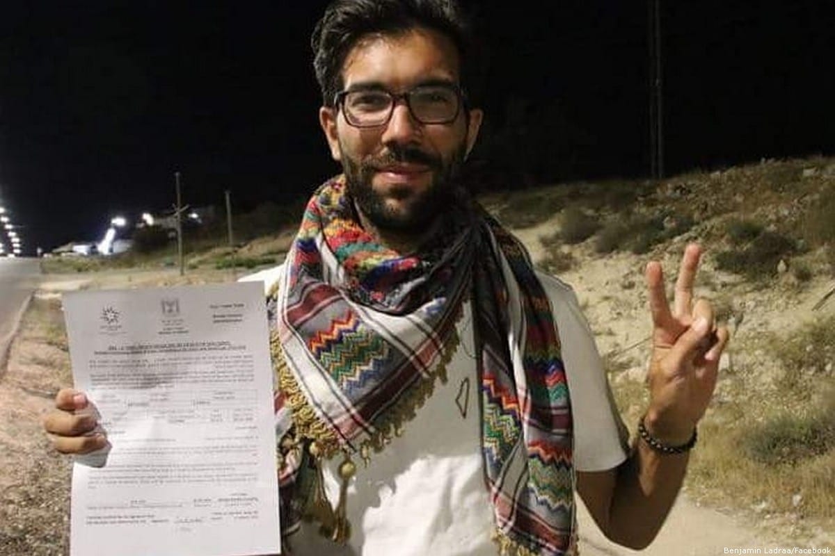 Swedish activist Benjamin Ladraa is seen with his rejection statement after he was denied entry into Israel via Jordan [Benjamin Ladraa/Facebook ]