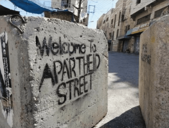 Graffiti saying Welcome to Apartheid Street, following the adoption of the Nation State Law [Twitter]
