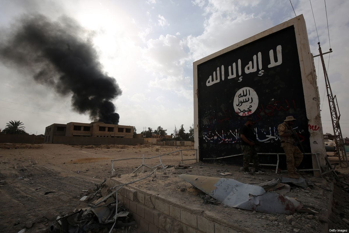 A Daesh sign at the entrance of the city of al-Qaim, in Iraq's western Anbar province near the Syrian border, seen on November 3, 2017 [AHMAD AL-RUBAYE/AFP/Getty Images]