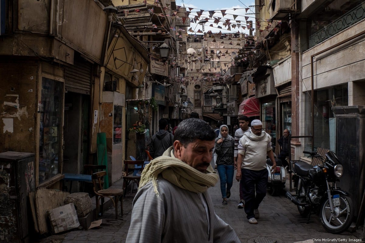 People are seen shopping in market street in Cairo, Egypt on 14 December 2016 [Chris McGrath/Getty Images]